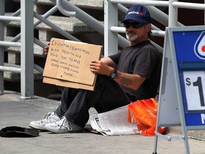 File photo of a panhandler known as Gramps on Ouellette Avenue in downtown Windsor, Ont. (NICK BRANCACCIO/The Windsor Star)