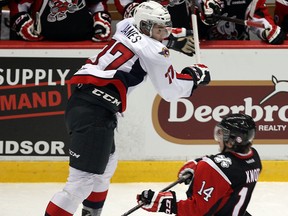 Windsor's Steven Janes, left, checks Niagara's Graham Knott at the WFCU Centre. (TYLER BROWNBRIDGE/The Windsor Star)