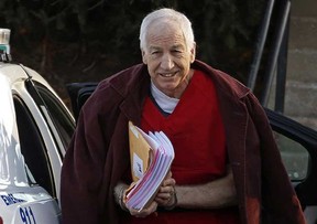 In this Jan. 10, 2013, file photo, former Penn State assistant football coach Jerry Sandusky arrives at the Centre County Courthouse for a post-sentencing hearing in Bellefonte, Pa. Penn State said Monday, Oct. 28, 2013 that it is paying $59.7 million to 26 young men over claims of child sexual abuse at the hands of Sandusky. The university said it had concluded negotiations that have lasted about a year. (AP Photo/Gene J. Puskar, File)