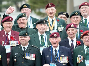 File photo of Lt.-Gen. Walter Semianiw (front row, left) stands with Canadian Korean War veterans as they pose for a group photo at the National Cememtery Thursday April 25, 2013 in Seoul, Republic of Korea. (THE CANADIAN PRESS/Adrian Wyld)