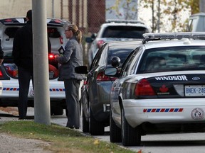 Windsor Police investigate a stabbing on the 1500 block of Windermere Avenue Wednesday October 23, 2013. Residents were kept away from their homes and Windsor Police K9 unit was on the scene. Other officers went door-to-door interviewing residents on the street. (NICK BRANCACCIO/The Windsor Star)