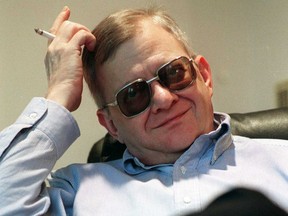 In this Feb. 4, 1998 file photo, writer Tom Clancy appears at his home in Calvert County, Md. Clancy, the bestselling author of more than 25 fiction and nonfiction books for the Penguin Group, died on Oct. 1, 2013 in Baltimore, Md. He was 66. (AP Photo/Vince Lupo)