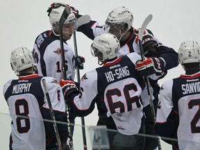 Trevor Murphy, left, Kerby Rychel, Josh Ho-Sang, Nikita Yazkov and Patrick Sanvido, celebrate Ho-Sang's goal in the second period as the Windsor Spitfires host the Niagara IceDogs in OHL action at the WFCU Centre, Sunday, Oct. 6, 2013.  (DAX MELMER/The Windsor Star)