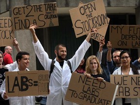 University of Windsor science students including Jacob Pfaff, centre, fourth-year biology, join other faculties for a rally near Chrysler Tower Tuesday, Oct. 1, 2013.  (NICK BRANCACCIO/The Windsor Star)