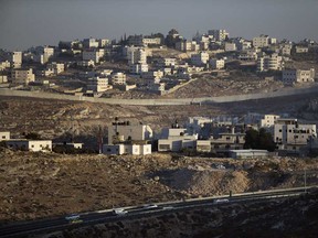 In this file photo, the Israeli West Bank barrier separates Jewish and Palestinian neighbourhoods on September 12, 2013 on the outskirts of Jerusalem, West Bank. (Uriel Sinai/Getty Images)