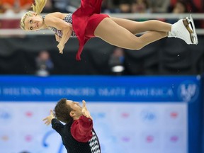 Canadians Kirsten Moore-Towers, top, and Dylan Moscovitch skate their short program in the pairs competition at Skate America at Joe Louis Arena in Detroit. (GEOFF ROBINS/AFP/Getty Images)