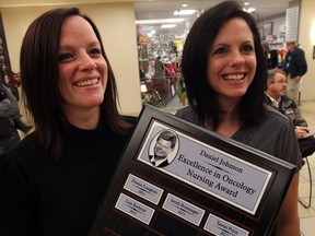 Nurses Kerri Drouillard, left, and Debbie Lucier were acknowledged for their dedication and kindness while receiving the Dan Johnson Excellence in Oncology Nursing Award at Windsor Regional Hospital Met Campus October, 22, 2013.  (NICK BRANCACCIO/The Windsor Star)