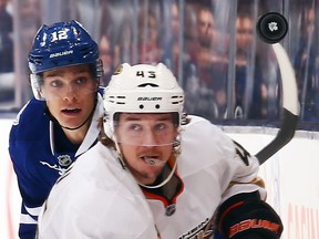 Toronto's Mason Raymond, left, checks Anaheim's Sami Vatanen Tuesday at the Air Canada Centre. (Photo by Abelimages/Getty Images)