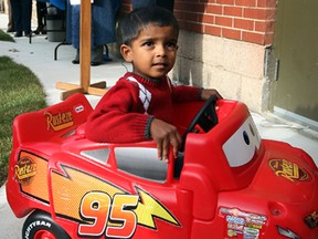 Toddler Jaiden Goisine, 2, looks for some driving space in the Tot Lot at Drouillard Place Friday October 25, 2013. (NICK BRANCACCIO/The Windsor Star)