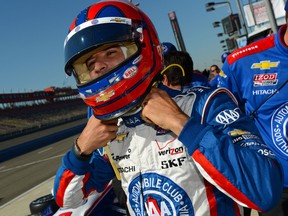 Brazil's Helio Castroneves takes a break during practice for the IZOD IndyCar Series MAVTV 500 World Championship at the Auto Club Speedway in Fontana, Calif. (Photo by Robert Laberge/Getty Images)