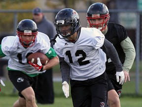Vancouver Island's Whitman Tomusiak, front, practises with the team Friday next to Windsor Stadium in preparation for the Canadian semifinals against the AKO Fratmen. (TYLER BROWNBRIDGE/The Windsor Star)