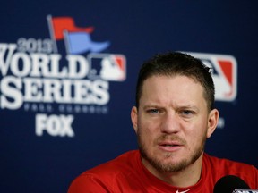 Boston Red Sox pitcher Jake Peavy speaks during a news conference before practice in St. Louis Friday. (AP Photo/Charlie Neibergall)