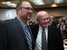 Windsor/Essex County Sports Hall of Fame inductee Ed Philion, left, takes a break with former Essex High School football coach Ross Spettigue at the Caboto Club. (DAX MELMER/The Windsor Star)