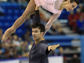 Meagan Duhamel, top, and Eric Radford of Canada skate during the pairs short program at Skate Canada International at Harbour Station in Saint John, New Brunswick,. (Photo by Dave Sandford/Getty Images)