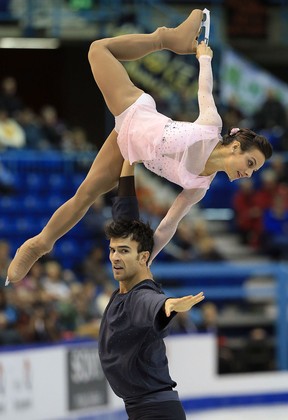 Meagan Duhamel, top, and Eric Radford of Canada skate during the pairs short program at Skate Canada International at Harbour Station in Saint John, New Brunswick,. (Photo by Dave Sandford/Getty Images)