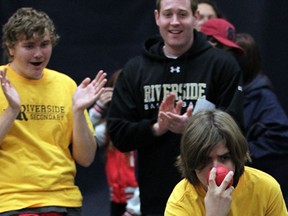 Simone Iaquinta, right, of Team Riverside, takes aim as teammate Tyler Pitre cheers during Four Corners Provincial School Championships - Windsor Bocce Provincial Qualifier, competitive 4-on-4 bocce tournament for local high school students with a disability, Tuesday October 29, 2013. (NICK BRANCACCIO/The Windsor Star)