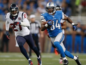 Detroit's Ryan Broyles, right, is chased by Houston's  Quintin Demps at Ford Field. (Photo by Gregory Shamus/Getty Images)