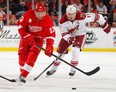 Detroit's Pavel Datsyuk, left, is checked by Martin Hanzal of the Coyotes at Joe Louis Arena. (Photo by Gregory Shamus/Getty Images)