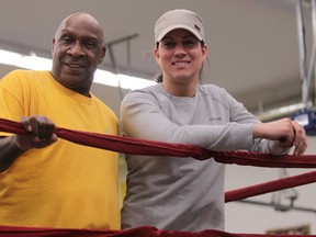 Windsor boxer Mary Spencer, right, and coach Charlie Stewart take a break after practice in WIndsor. (JASON KRYK/ The Windsor Star)