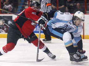 Windsor's Ty Bilcke, left, checks Mississauga's Eric Diodati at the WFCU Centre last year. (DAX MELMER/The Windsor Star)