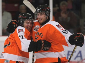 Essex's Daniel McIntyre, left, and Michael Popel celebrate a goal against Wallaceburg in Essex Tuesday. (DAN JANISSE/The Windsor Star)