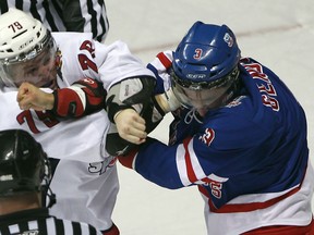 Spitfires forward Ty Bilcke, left, fights Cory Genovese when he played for the Kitchener Rangers in 2012. (JASON KRYK/The Windsor Star)