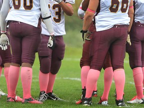 Members of the Catholic Central football team wear pink socks in support of breast cancer awareness at Windsor Stadium last year. (DAN JANISSE/The Windsor Star)