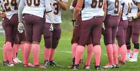 Members of the Catholic Central football team wear pink socks in support of breast cancer awareness at Windsor Stadium last year. (DAN JANISSE/The Windsor Star)