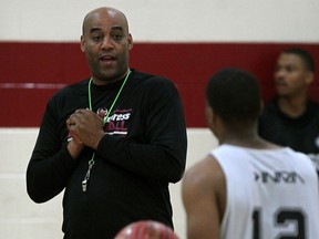 Windsor Express head coach Bill Jones, left, talks with Darren Duncan during practice at the Rose City Islamic Centre. (NICK BRANCACCIO/The Windsor Star)