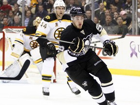 Pittsburgh's Jayson Megna, right, skates against the Boston Bruins at Consol Energy Center Wednesday. (Photo by Justin K. Aller/Getty Images)