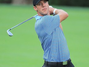 Canada's Graham DeLaet of the International Team hits a shot during a practice round Wednesday at The Presidents Cup at the Muirfield Village Golf Club in Dublin, Ohio.  (Photo by David Cannon/Getty Images)