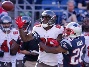 Tampa Bay's Kevin Ogletree, left, is covered by New England's Logan Ryan at Gillette Stadium two weeks ago. (Photo by Jim Rogash/Getty Images)