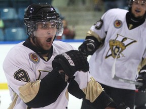 LaSalle's Rio Anzolin, left, celebrates a goal against Lambton Shores in junior B hockey at the Vollmer Centre. (DAN JANISSE/The Windsor Star)