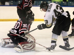 LaSalle's Daniel Beaudoin, right, scores a goal on Lambton Shores goalie Justin Tugwell at the Vollmer Centre. (DAN JANISSE/The Windsor Star)