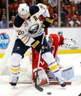 Buffalo's Thomas Vanek, left, tries to deflect the puck past Detroit goalie Jimmy Howard Wednesday. (AP Photo/Paul Sancya)