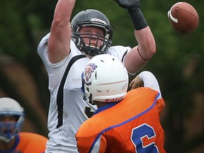 AKO's John Moynahan, top, breaks up a pass against St. Leonard at Windsor Stadium. (DAX MELMER/The Windsor Star)