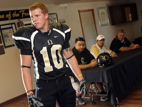 AKO's Mason Beekhuis models the team's new uniforms during a press conference in 2011.  (TYLER BROWNBRIDGE/The Windsor Star)