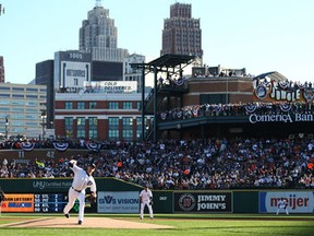 Detroit's Doug Fister, left, throws a pitch during Game 4 of the American League Division Series at Comerica Park. (Photo by Rob Carr/Getty Images)