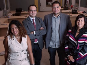 Maxine Foster, 26, left, Irek Kusmierczyk, director of Robotics and Youth Programs at WETech Alliance, Kirt Dedam, 27, and Elayne Isaacs, tenant laison with Can-Am Urban Native Non-profit Homes, are pictured at the Downtown Windsor Business Accelerator. (DAX MELMER / The Windsor Star)