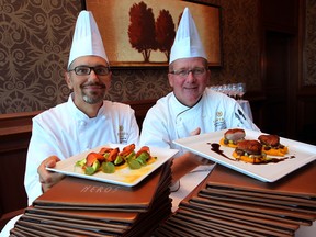 Neros chef Deron LePore, left, and Caesars Windsor executive chef Patrick McClary with House Smoked Salmon and Maple Glazed Brome Lake Duck, part of the new menu at Neros. (NICK BRANCACCIO / The Windsor Star)