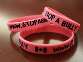Pink wrist bands are unveiled during a press conference to announce an anti bullying campaign in this file photo.   (TYLER BROWNBRIDGE/The Windsor Star)