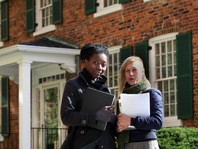 Toronto artist Camille Turner, left, and Alana Bartol of the Arts Council for Windsor and Region are shown Oct. 25, 2013, outside the historic Francois Baby house on Pitt Street. Turner is researching the Baby family's little-known history of slave-ownership. (Nick Brancaccio / The Windsor Star)