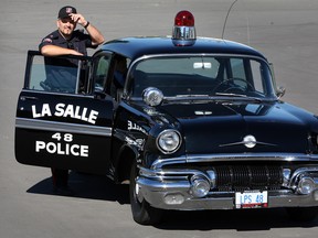 LaSalle Police Sr. Const. Mauro Tonin with a restored 1957 Pontiac Laurentian, a replica of LaSalle's Car 48. (NICK BRANCACCIO / The Windsor Star)