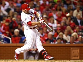 Matt Holliday of the St. Louis Cardinals hits a solo home run in the fourth inning against the Boston Red Sox during Game 5 of the World Series at Busch Stadium on October 28, 2013 in St Louis. (Elsa/Getty Images)