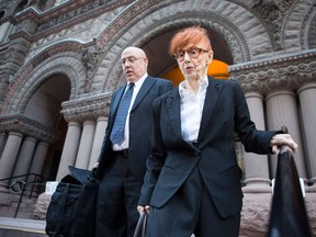 Peace activist Audrey Tobias, 89, walks to a Toronto court after speaking with journalists during a recess on Thursday October 2, 2013. The activist stands trial over refusing to fill out the 2011 census because it's processed with software from a U.S. military contractor. (Chris Young/The Canadian Press)