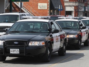A convoy of OPP vehicles arrive in Harrow in March 2009, when Essex switched from having a municipal police force to contracting OPP. (Dan Janisse / The Windsor Star)