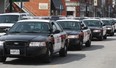 A convoy of OPP vehicles arrive in Harrow in March 2009, when Essex switched from having a municipal police force to contracting OPP. (Dan Janisse / The Windsor Star)