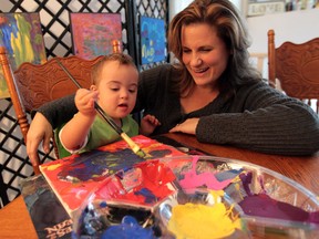 Tina Greco watches as  her two-year-old son Vincenzo paints a picture at their LaSalle, Ontario home on October 23, 2013.  Greco has planned an art show at Devonshire Mall from Oct. 28th to Nov. 3rd which will showcase paintings by young people with Down syndrome. (JASON KRYK/The Windsor Star)