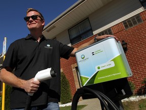 Christopher Misch, vice-president of Sun Country Highway, with one his company's charging stations at the Comfort Inn in Windsor. (TYLER BROWNBRIDGE / The Windsor Star)