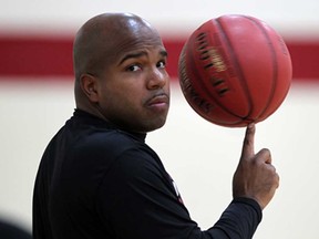 Windsor Express assistant coach Scott Newman spins a basketball during the team's first official practice of the new season at Rose City Islamic Centre October 21, 2013. (NICK BRANCACCIO/The Windsor Star)